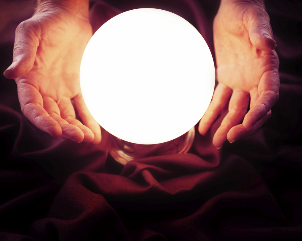 Human hands near a flashing ball