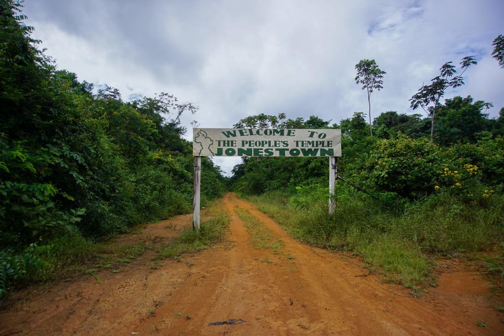 Picture of a welcome sign at the entrance of Jonestown, Guyana mass murder