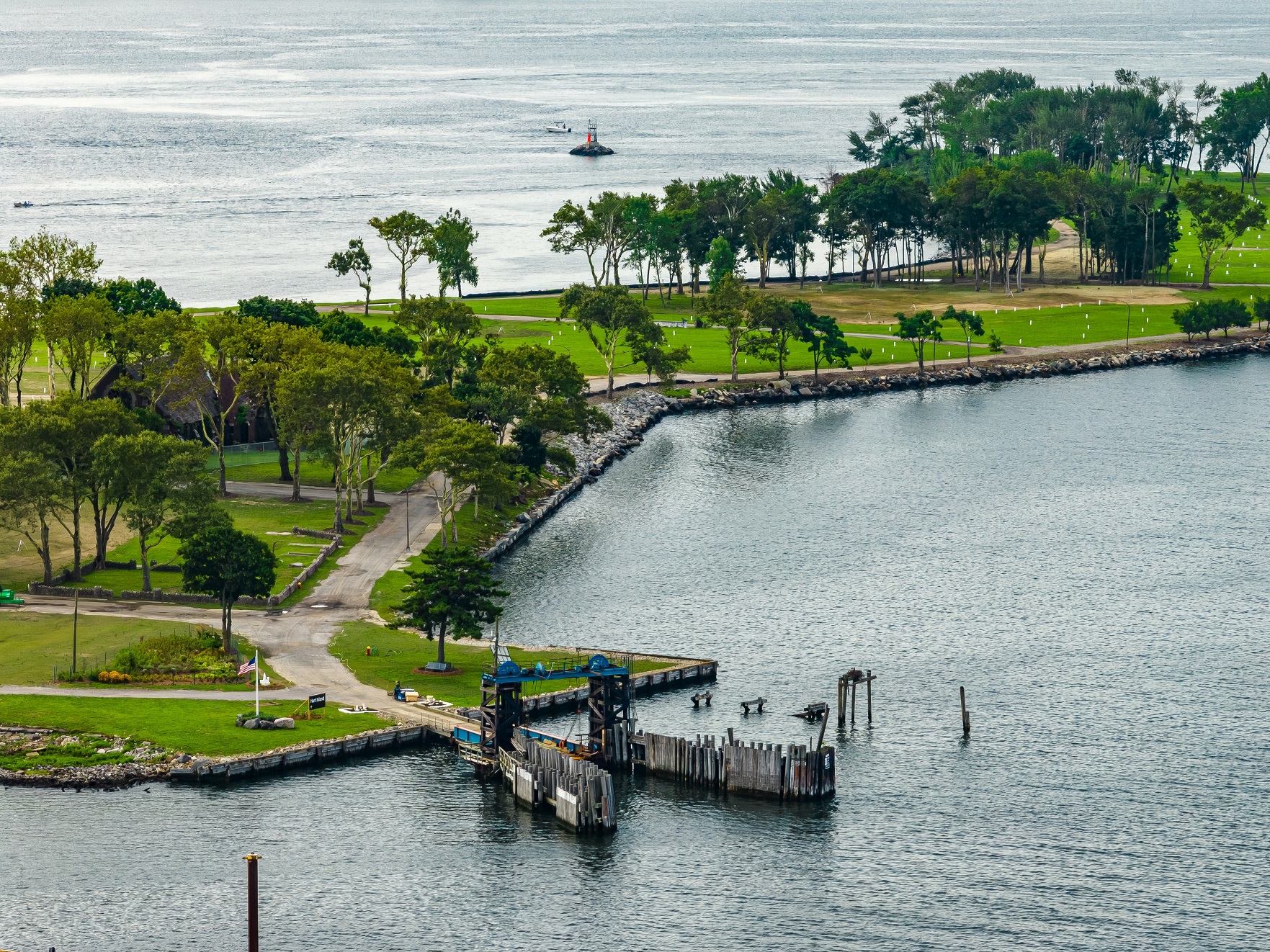 An aerial view of the tranquil but secretive beauty of Hart Island, nestled in the Long Island Sound on a sunny day.