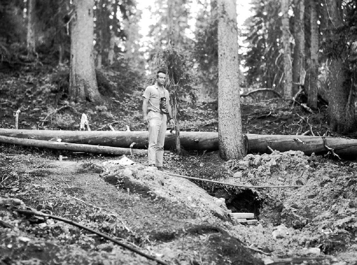 Man with camera stands in the woods - 1963