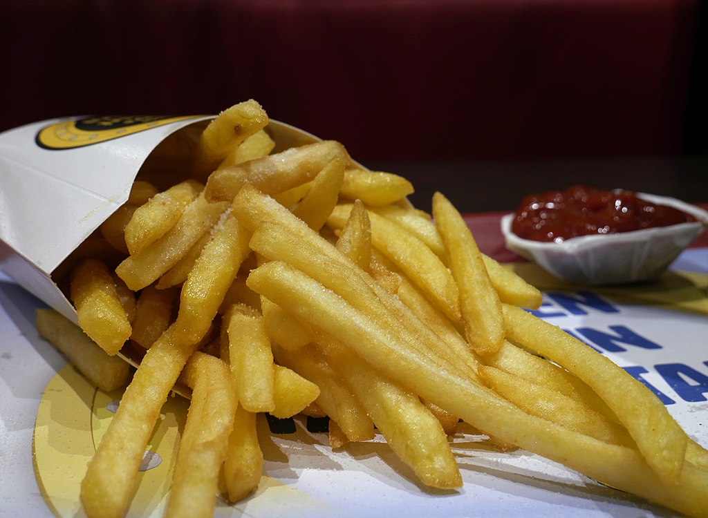 French fries and ketchup placed on a table