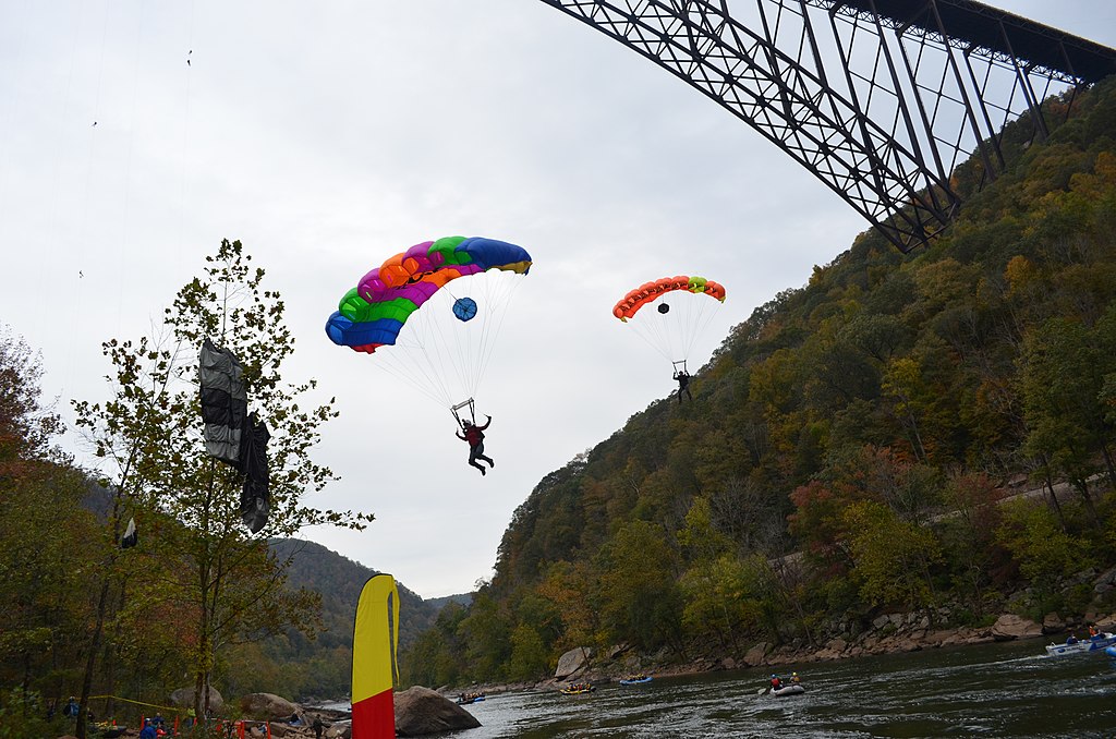 BASE jumpers landing on a Bridge Day festival