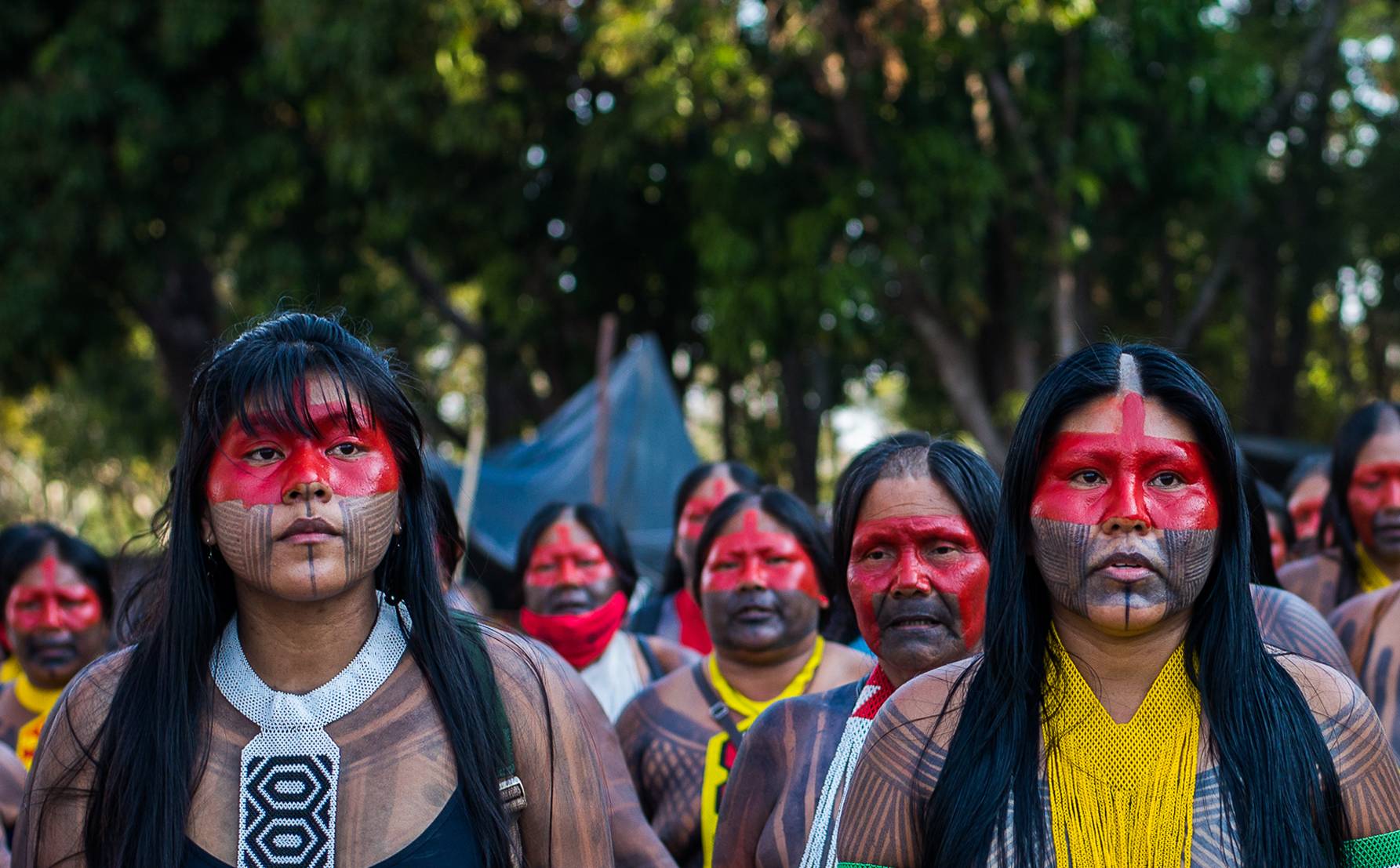 Kayapó women in traditional make up and clothes
