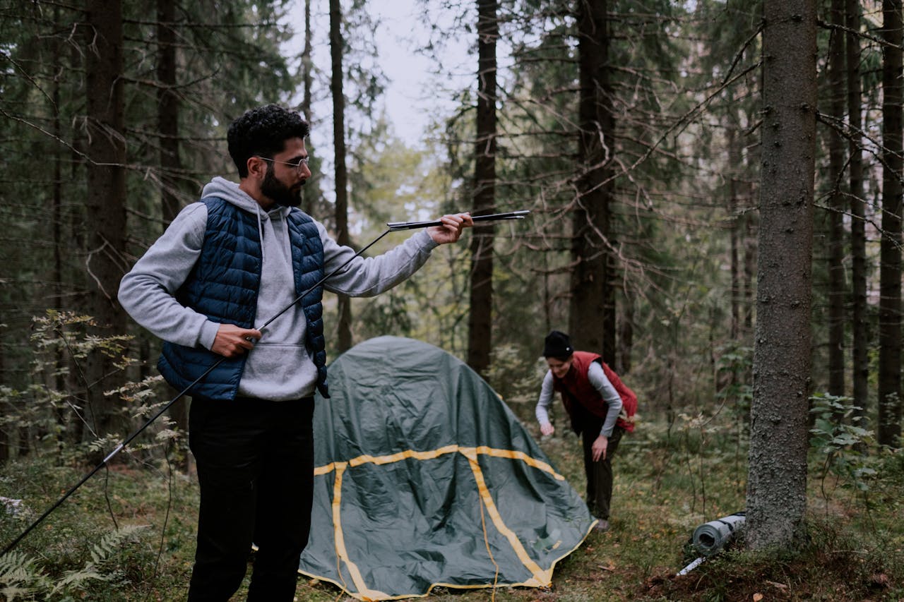 People camping in the woods.