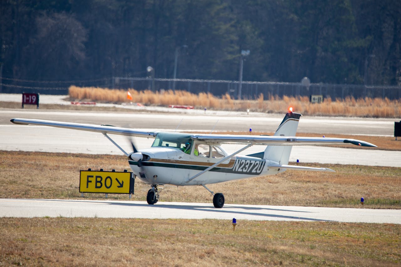 Light aircraft on runway.