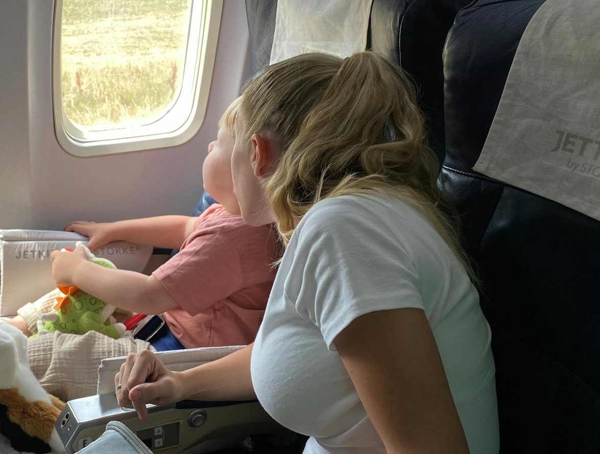 Woman and kid in plane.