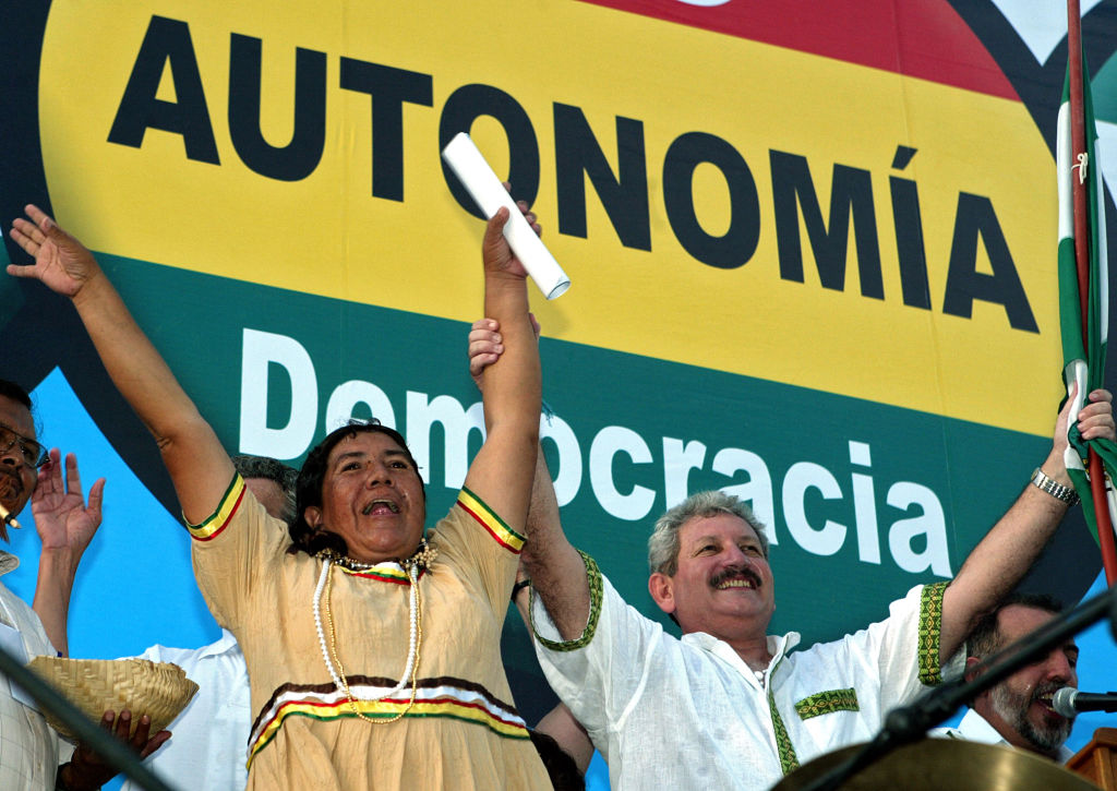 The Governor of Santa Cruz Ruben Costas (R) and ayoreo native Rita Oreyai