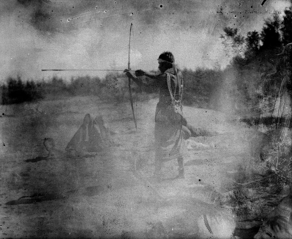 man with bow and arrow