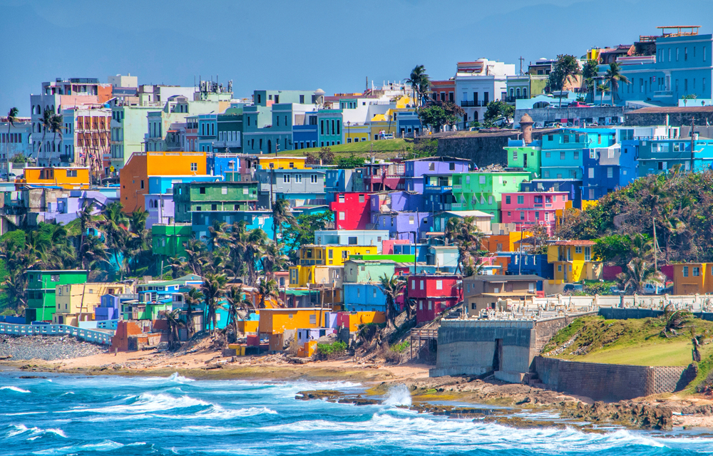 Colorful houses line the hillside over looking the beach in San Juan