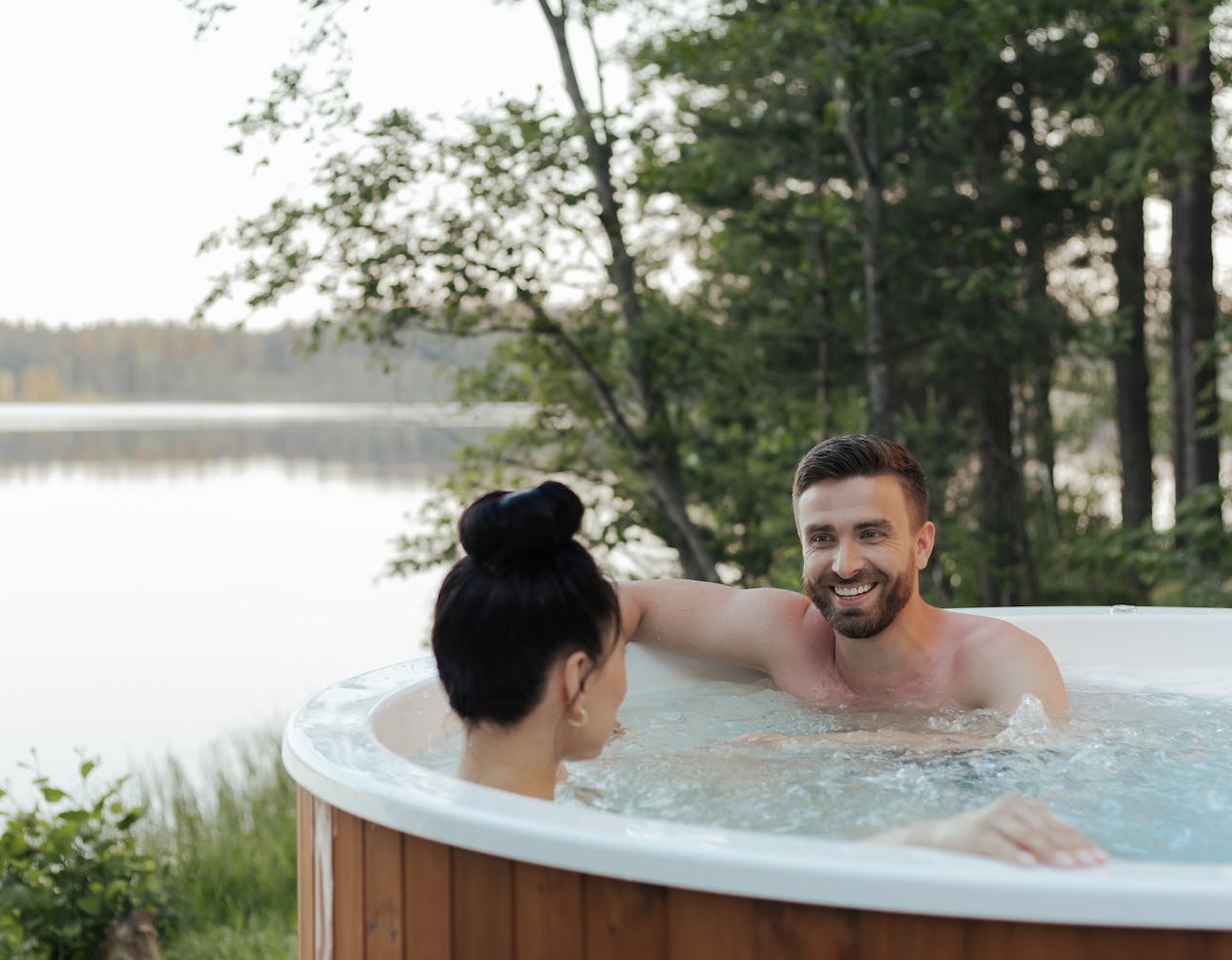 Man and woman in hot tub.