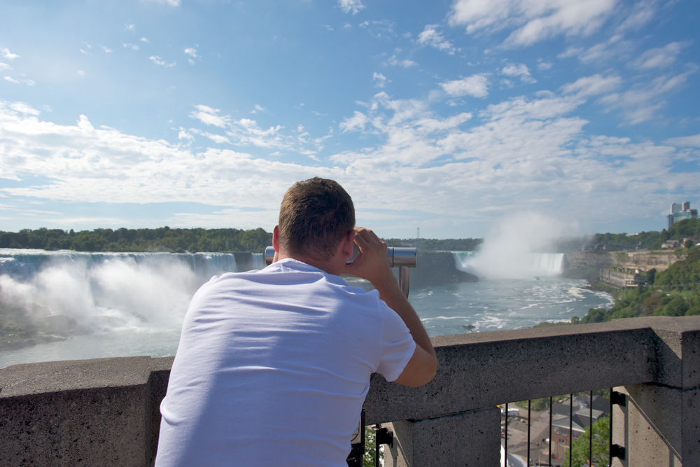 Man looking at Niagara Falls
