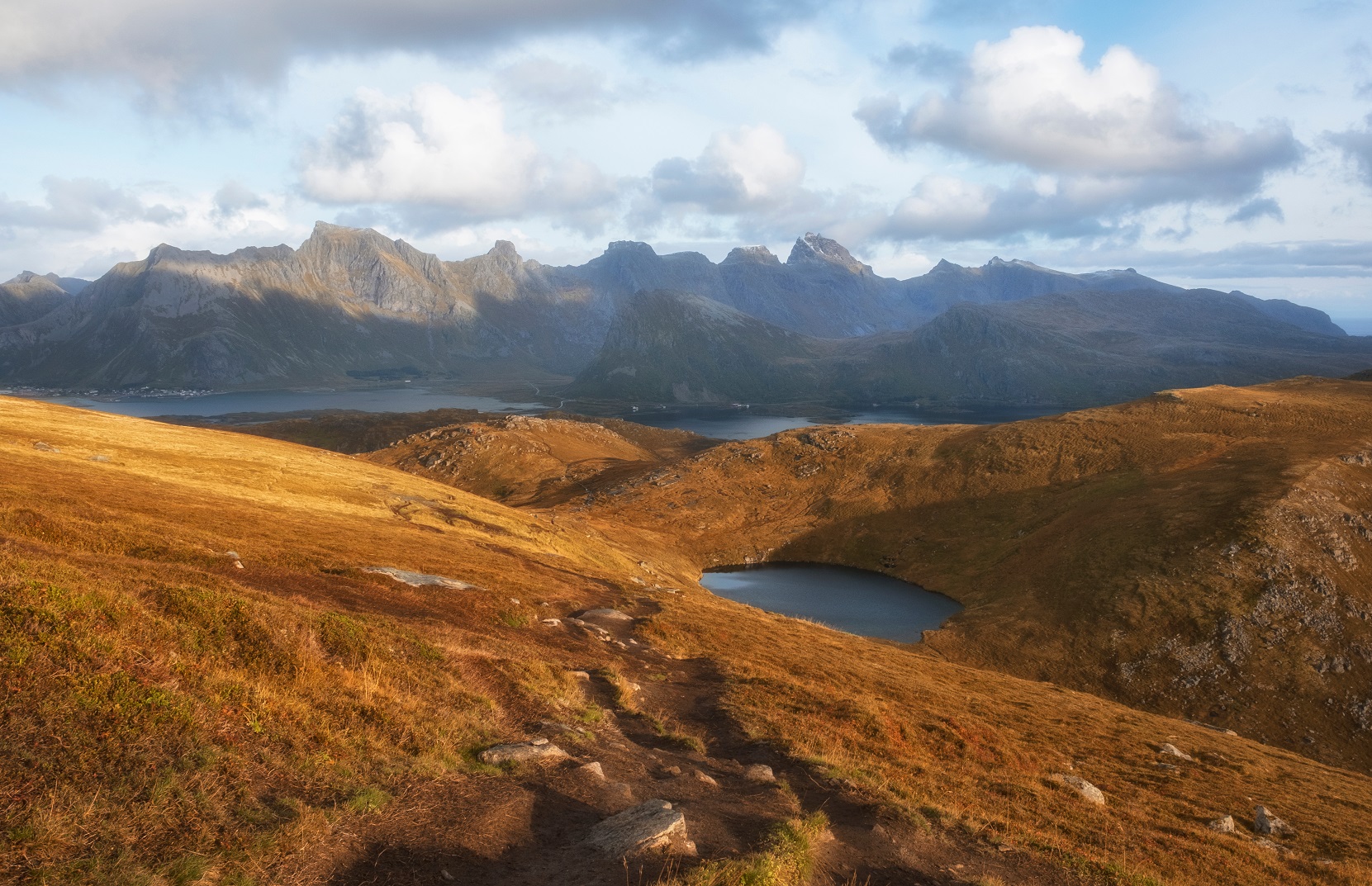 Beautiful view of the chocolate hills, lakes, sea and mountains at sunset.