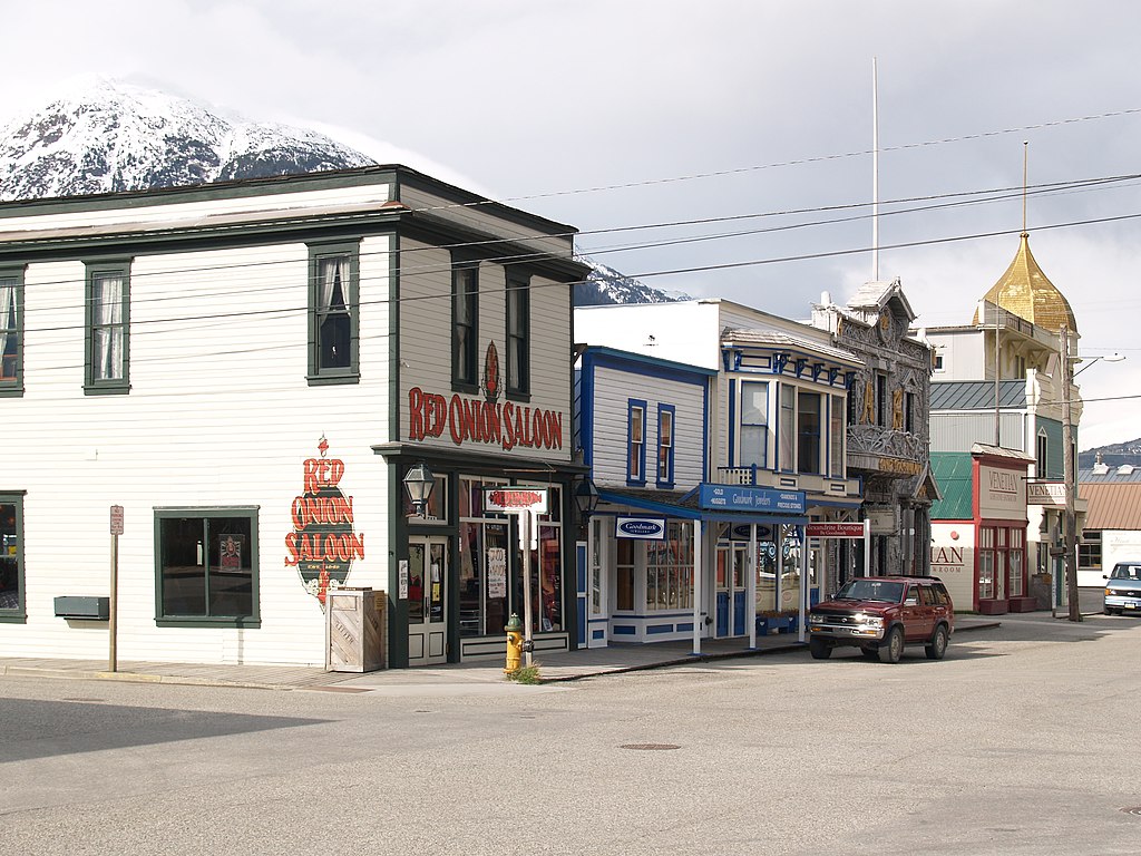 Chilkoot Trail Skagway Historic District. Red Onion Saloon was brothel. Snowy mountains in background