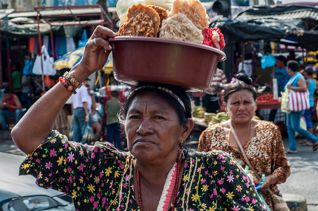 Wayuu woman selling cocadas (coconut candies) in a market