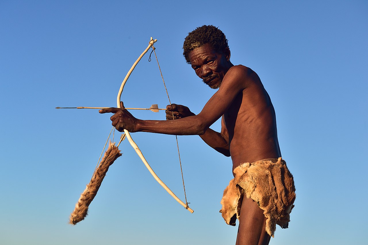 Tribe man with bow and arrow.