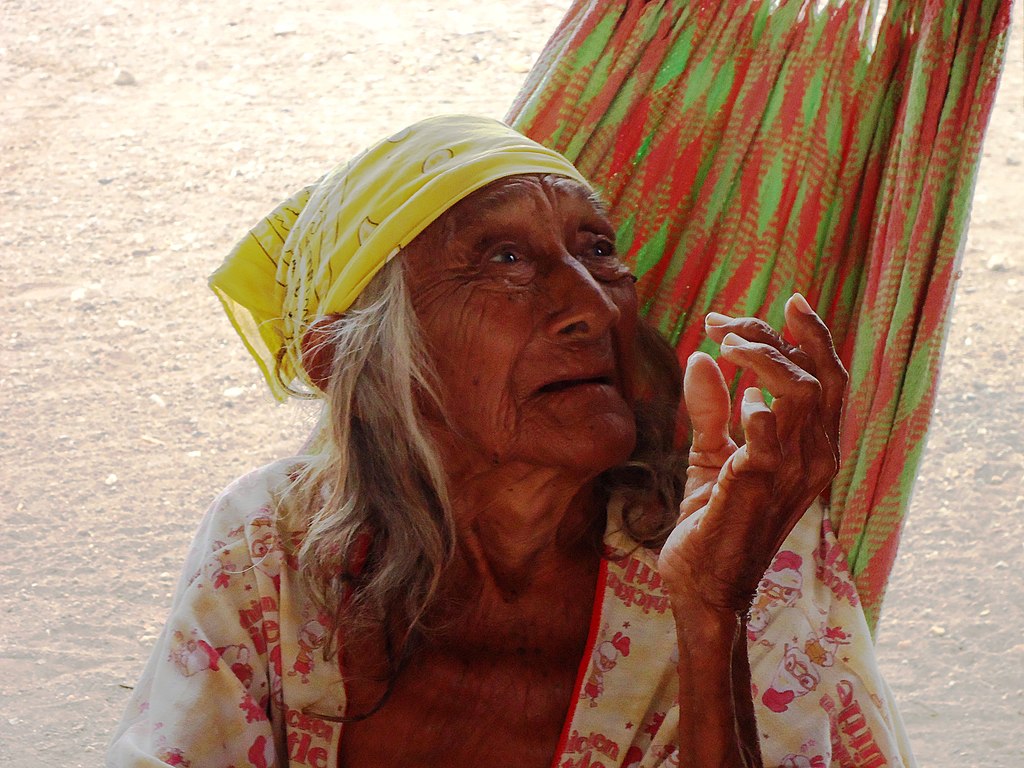 Old Wayuu woman dressed in traditional tribe outfit