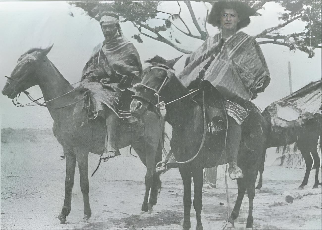 Grayscale Photo of Wayuu people on horses
