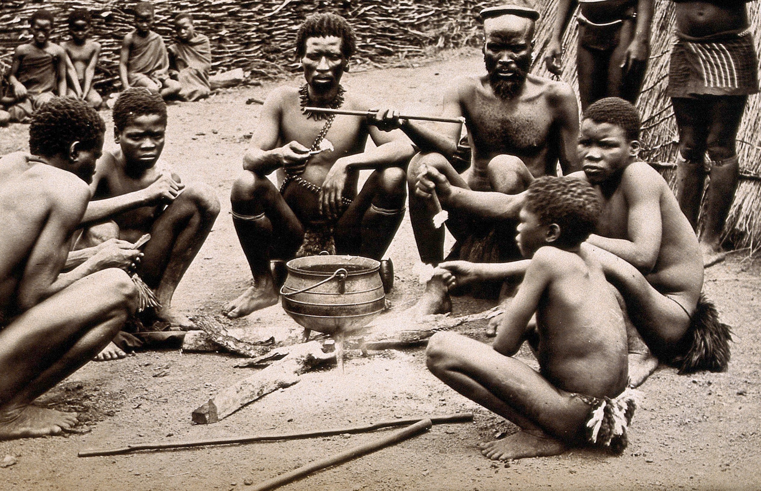 Men of the Hlubi tribe eating.