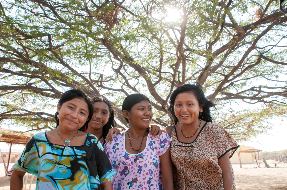 Young friends women of the Wayuu people in the desert of La Guajira.