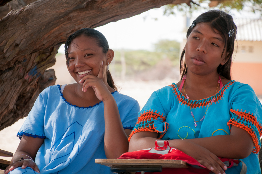Young friends women of the Wayuu people in the desert of La Guajira.