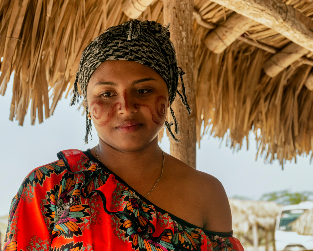 Young woman from the Wayuu community in a typical Dividivi community dwelling