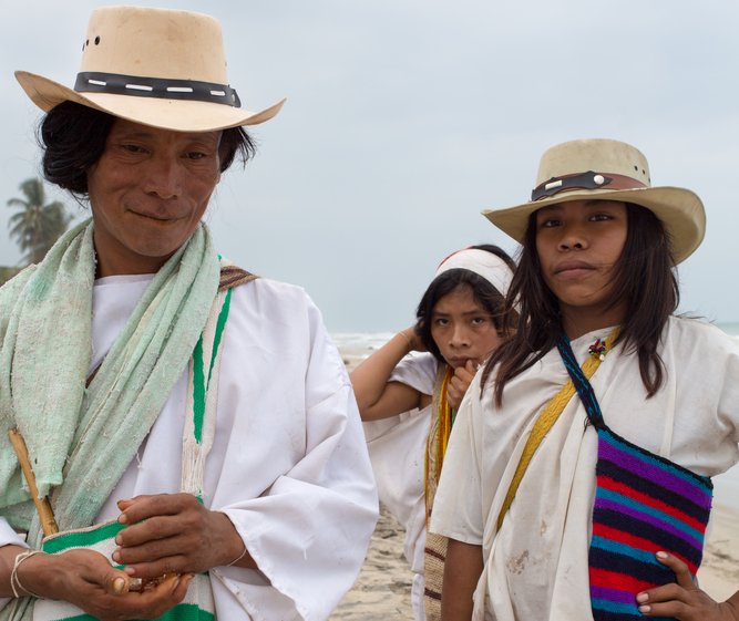Group of unidentified Wayuu familly members posing in front of the camera