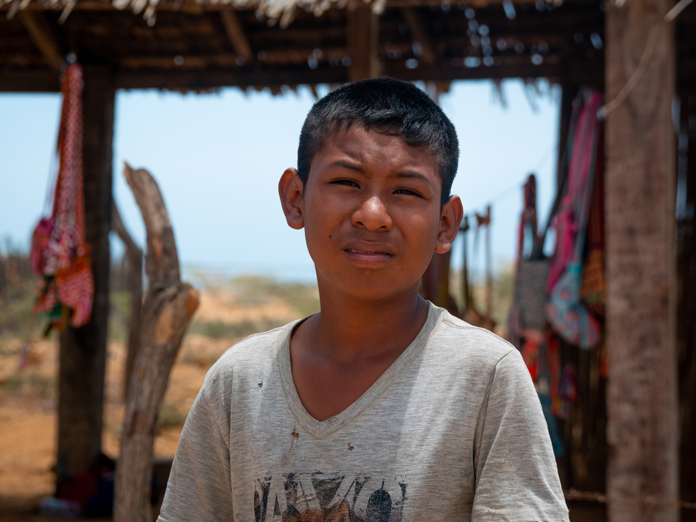 Portrait of a Wayuu Boy Looking at the Camera in a Sunny Day