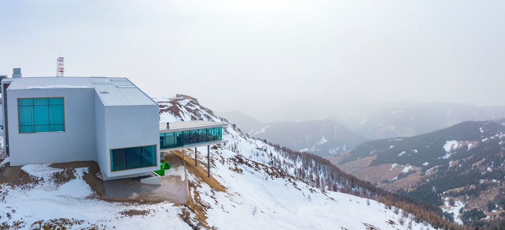 View of alpine museum and restaurant on snowy landscape