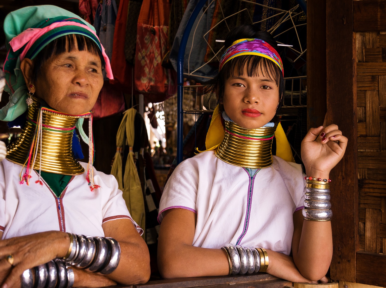 Portrait of two Kayan Lahwi tribe women with neck rings. Long neck woman. - 2019