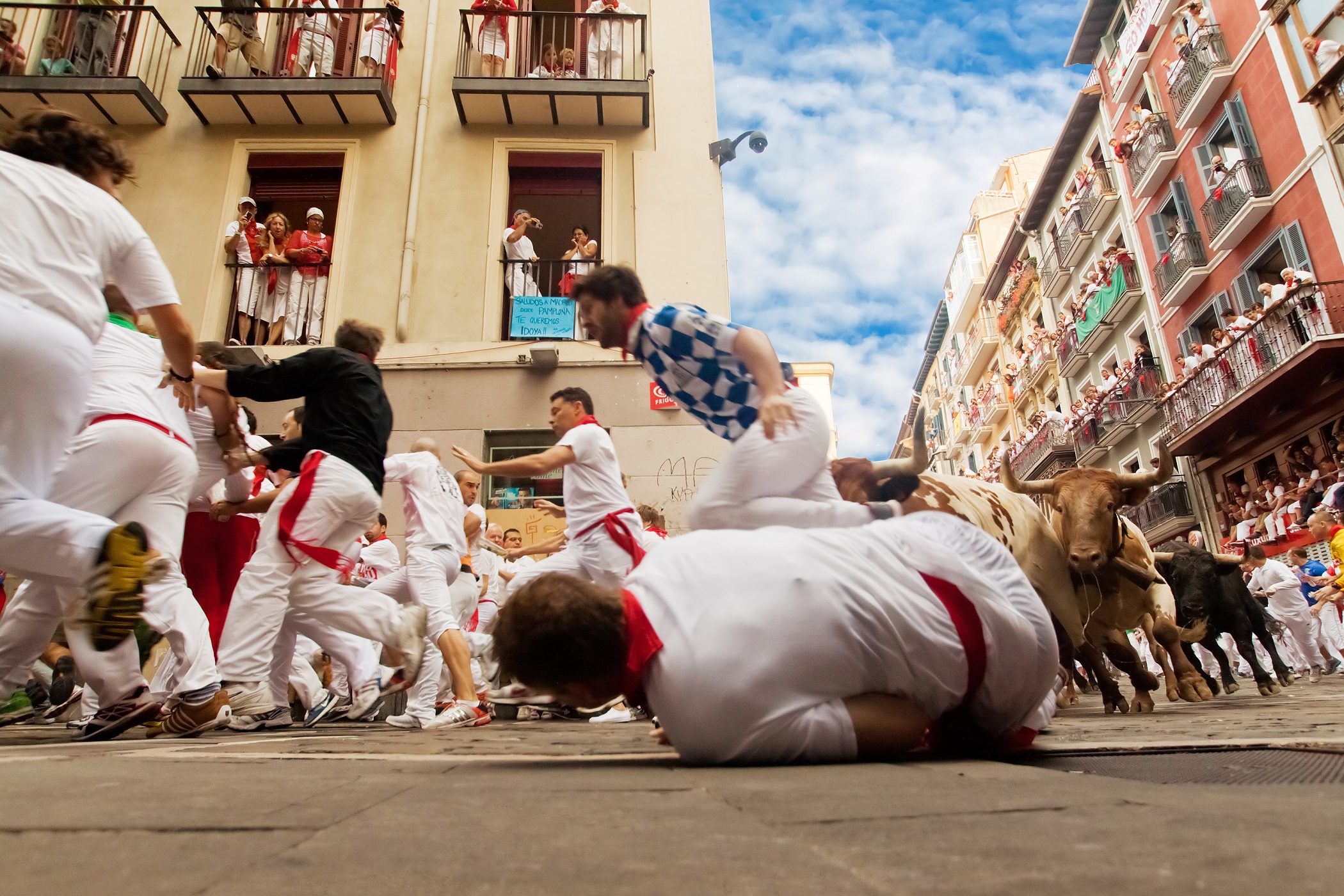 People run from bulls on street during San Fermin festival in Pamplona, Spain on July 12, 2013
