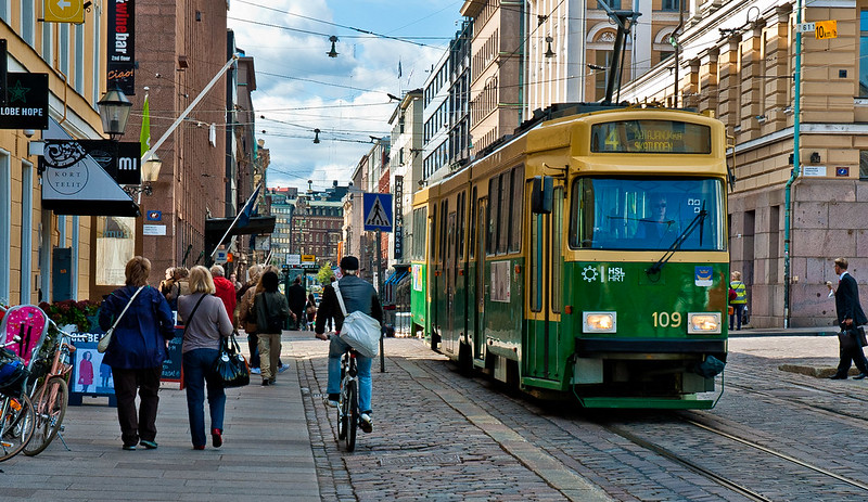 People walking on a Tram street in Helsinki Finland
