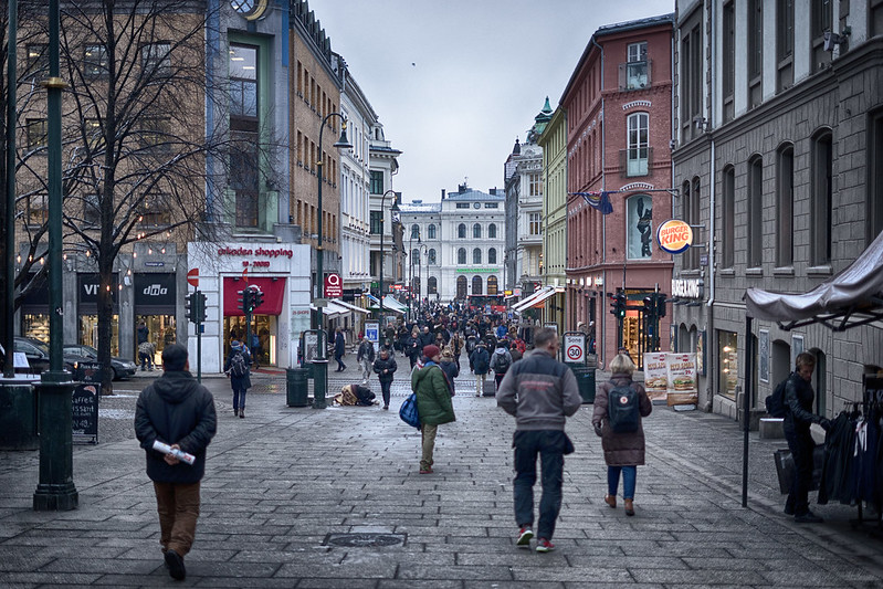 People walking on the streets of Oslo, Norway, typical looking street in North Europe
