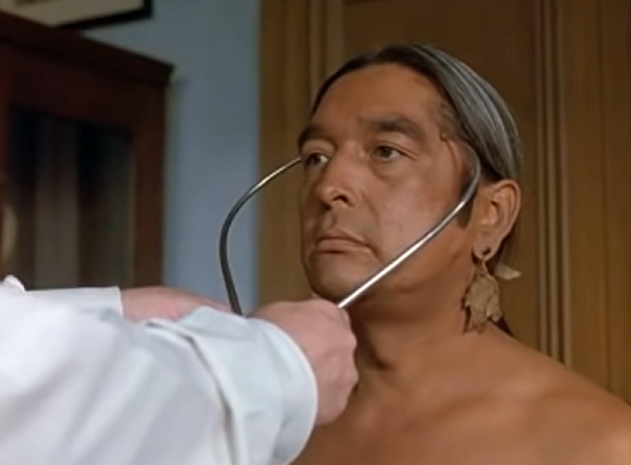 Screenshot of Ishi having a med. exam - from The Last of His Tribe (1992)
