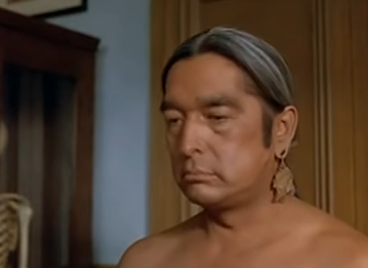 Screenshot of Ishi looking down with sad face - from The Last of His Tribe (1992)