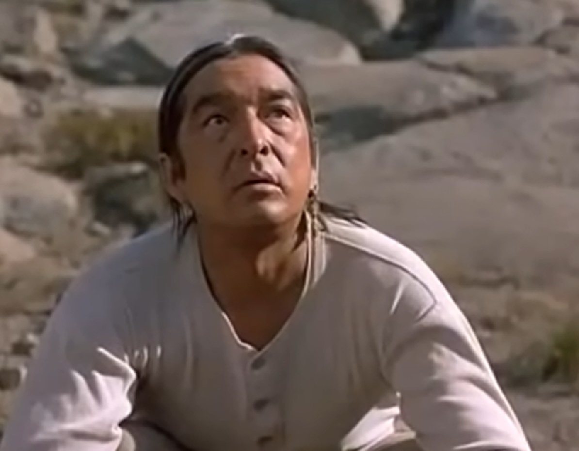 Screenshot of Ishi looking at front with sad face - from The Last of His Tribe (1992)
