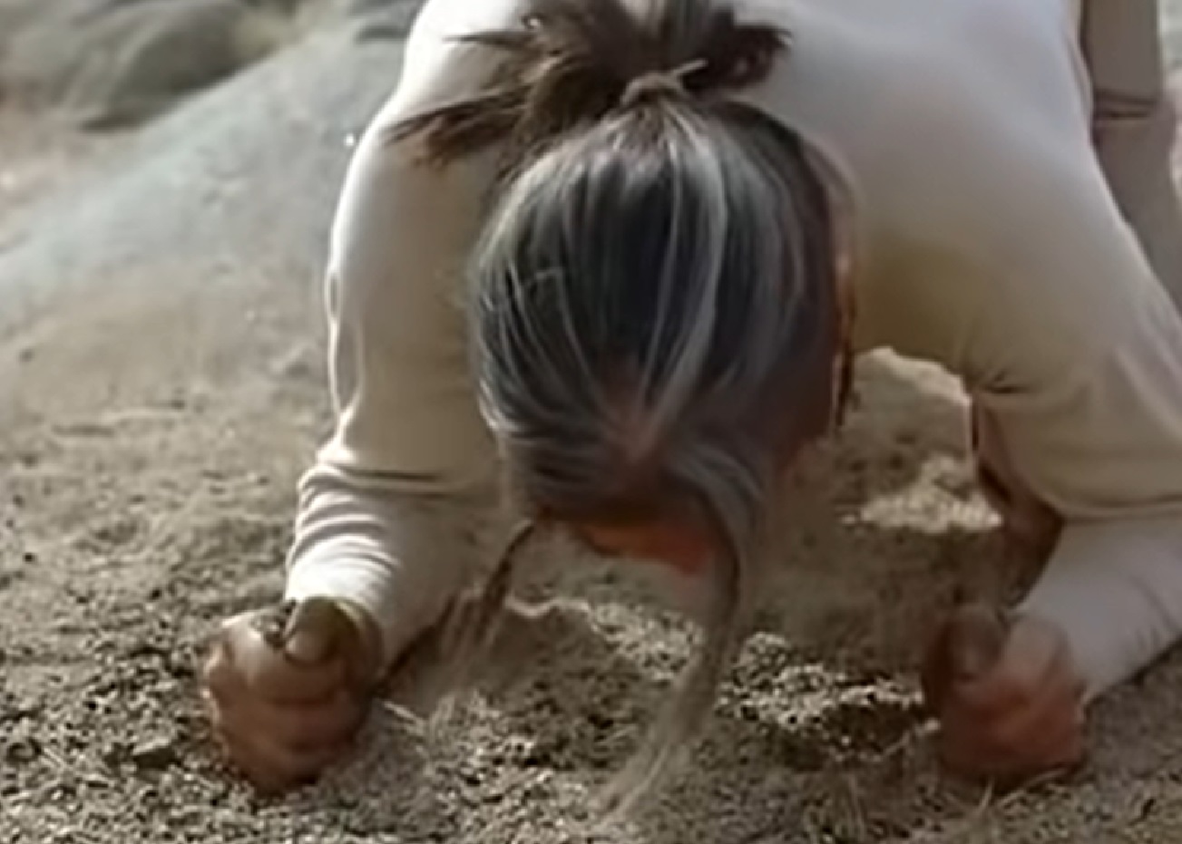 Screenshot of Ishi in white shirt crying - from The Last of His Tribe (1992)