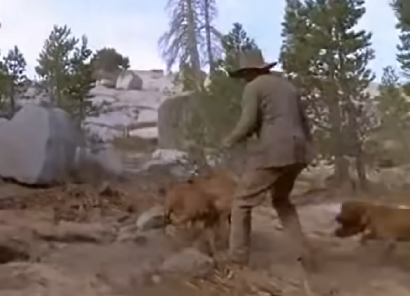 Screenshot of man with dogs running a trace - from The Last of His Tribe (1992)