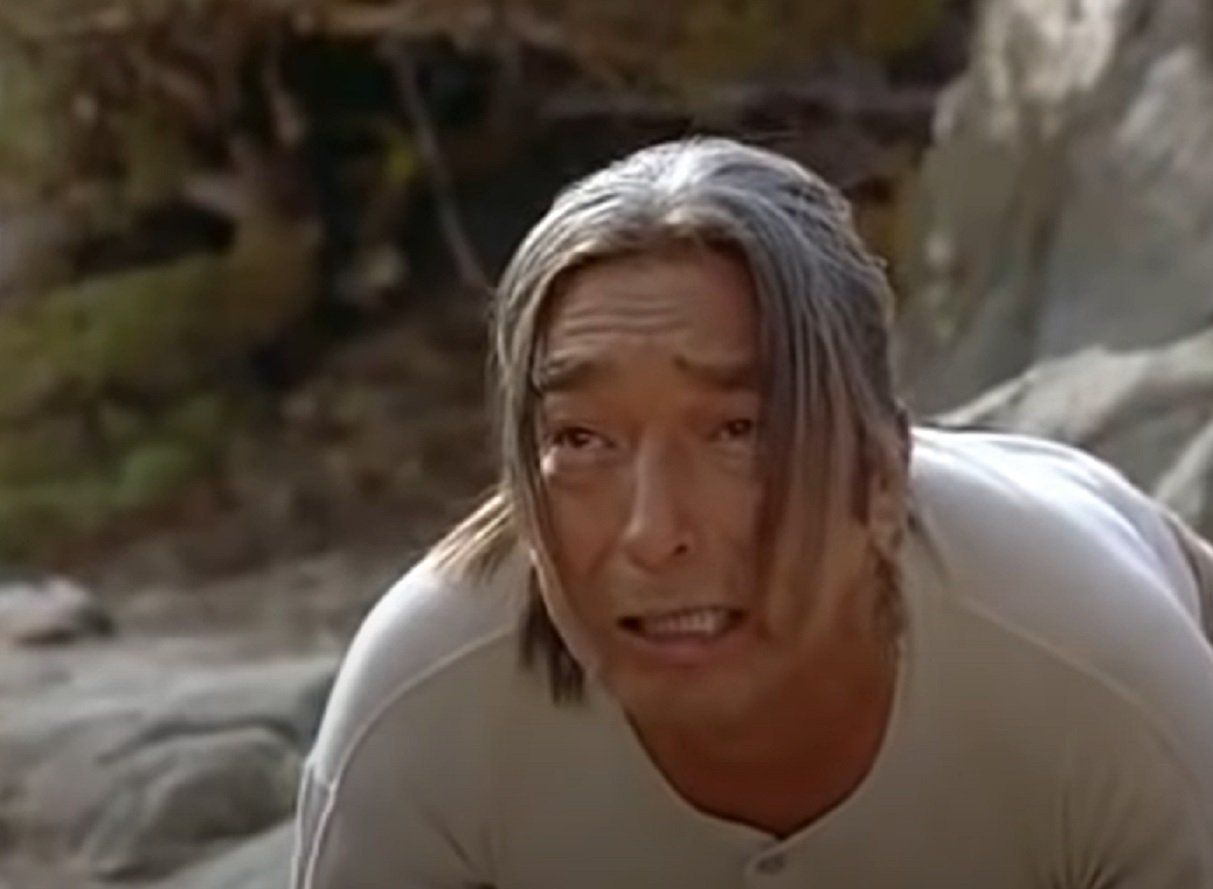 Screenshot of Ishi looking at front with sad face - from The Last of His Tribe (1992)
