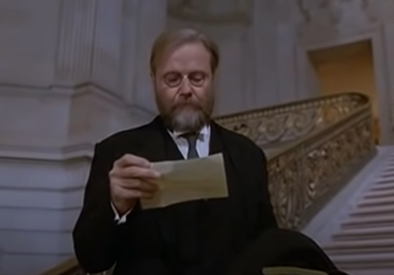 Screenshot of Alfred Kroeber reading a telegram - from The Last of His Tribe (1992)