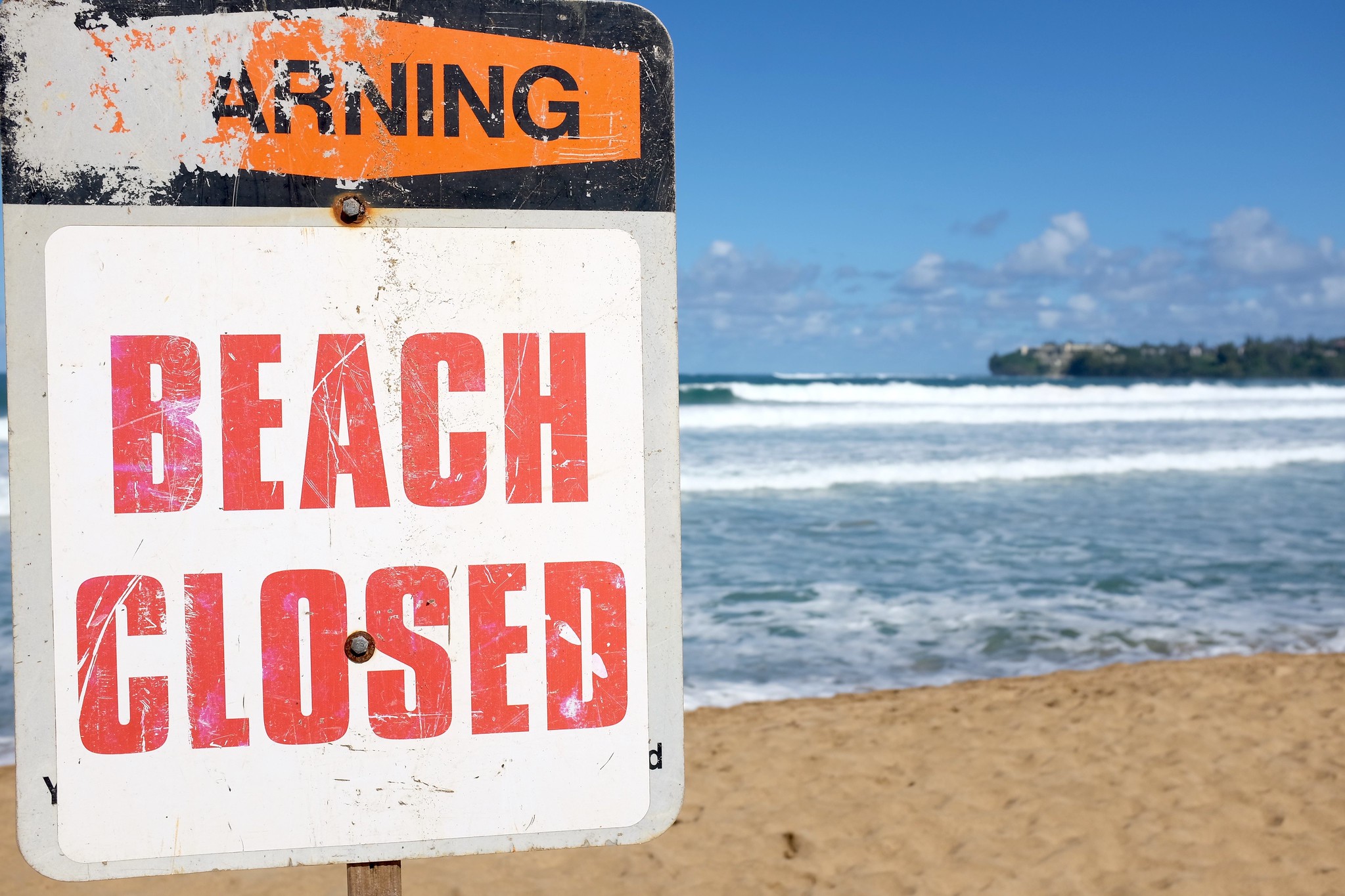 Beach closed sign.