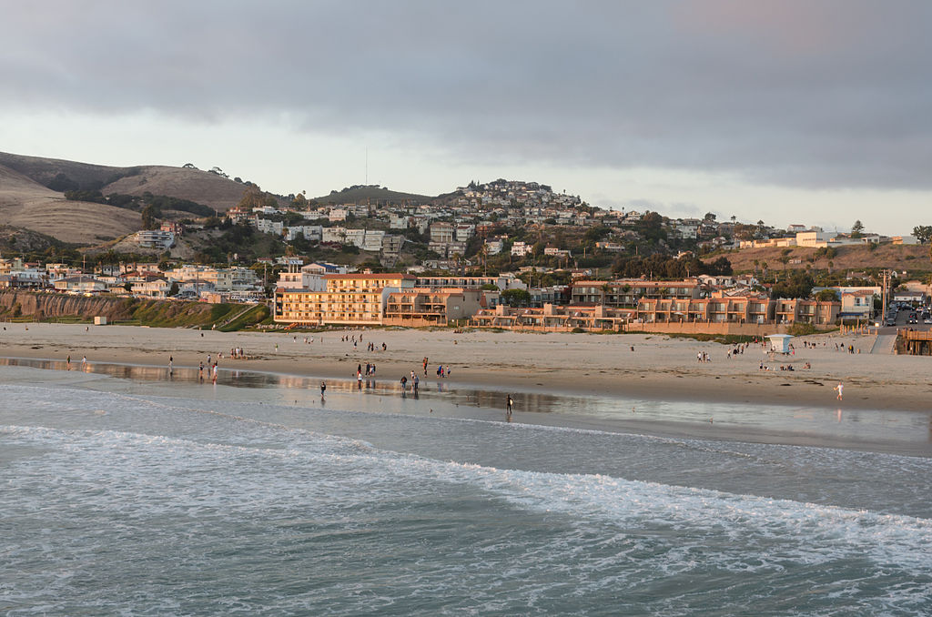 View of Pismo Beach as seen from the pier with cloudy sky in background