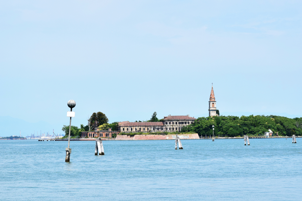 Aerial view of the plagued ghost island of Poveglia in the Venetian lagoon Venice, Italy