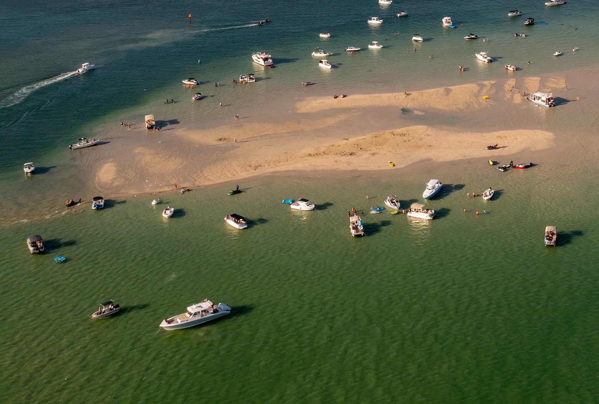 women at the beach and sandbar split image