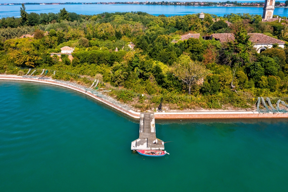 Aerial view of the plagued ghost island of Poveglia in the Venetian lagoon Venice, Italy