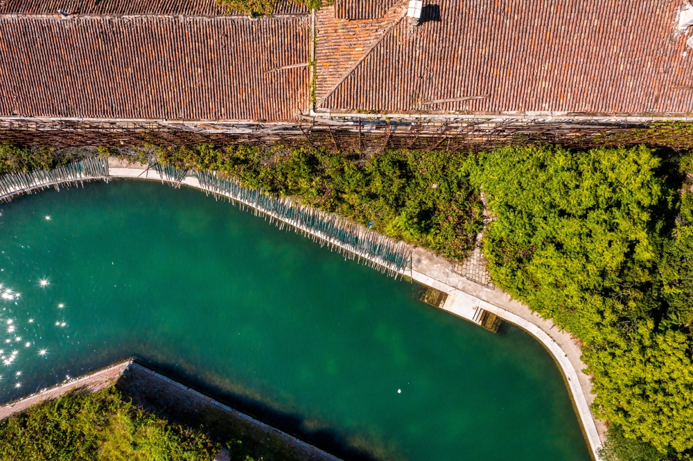 Aerial view of the plagued ghost island of Poveglia in the Venetian lagoon Venice, Italy