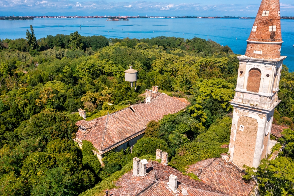 Aerial view of the plagued ghost island of Poveglia in the Venetian lagoon Venice, Italy