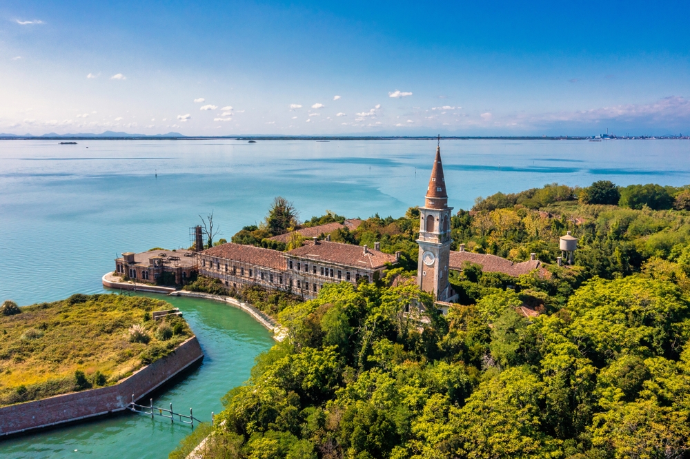 Aerial view of the plagued ghost island of Poveglia in the Venetian lagoon Venice, Italy