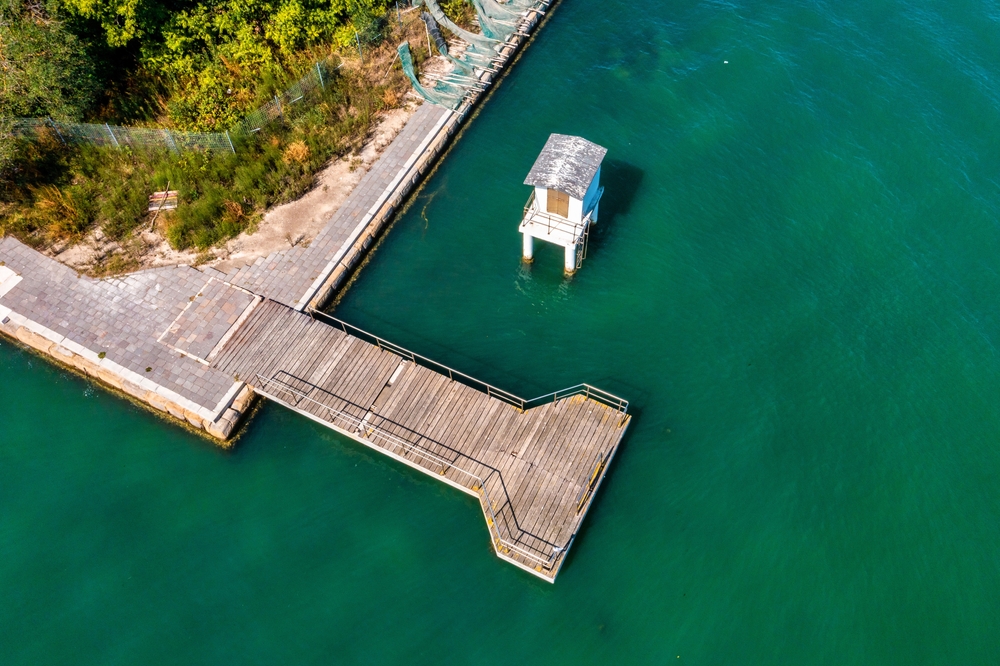 Aerial view of the plagued ghost island of Poveglia in the Venetian lagoon Venice, Italy