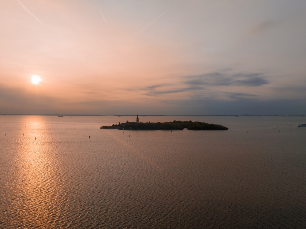 Aerial view of the plagued ghost island of Poveglia in the Venetian lagoon Venice, Italy