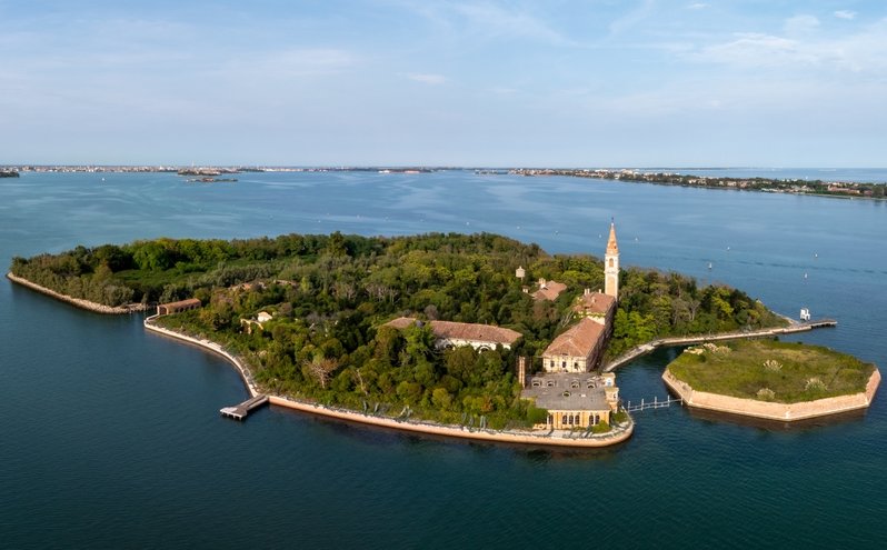 Aerial view of the plagued ghost island of Poveglia in the Venetian lagoon Venice, Italy